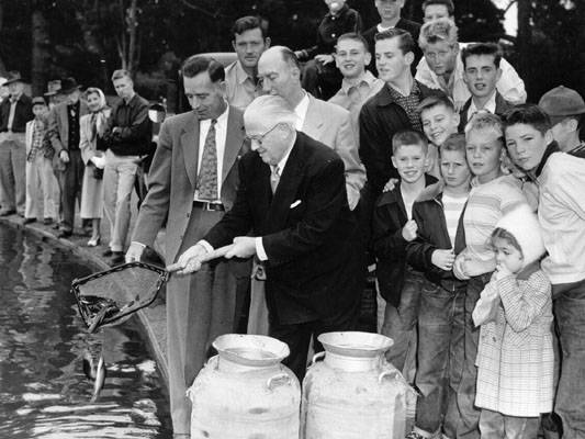 File:Elmer Robinson releases first fish in Spreckels Lake 1953 AAA-7967.jpg