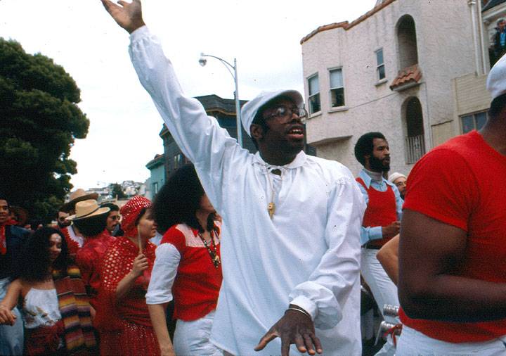 File:Black-guy-in-white-w-arm-extended.jpg