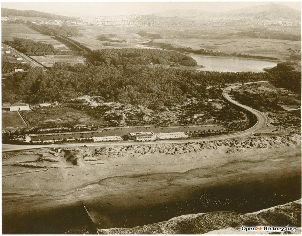 Fleishhacker Pool c 1930 Aerial view of Fleishhacker pool and playground looking southeast. Mothers Building at far left. Breakers on Ocean Beach in foreground. Lake Merced upper right. wnp70.0495.jpg