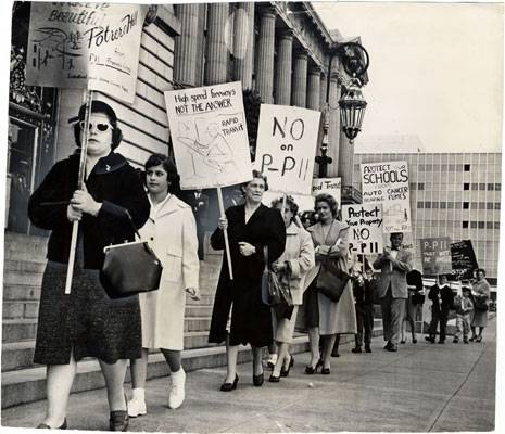 Image:Picketers protesting against the Southern Freeway marching at City Hall April 18 1961 AAF-0671.jpg