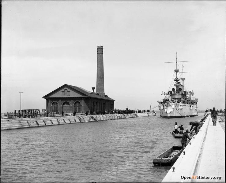 File:Hunters Point slip c 1900 Battleship entering slip. Pumphouse with tall smokestack at end of pier. G810 SH-592 GGNRA-Behrman GOGA 35346 wnp71.0345.jpg