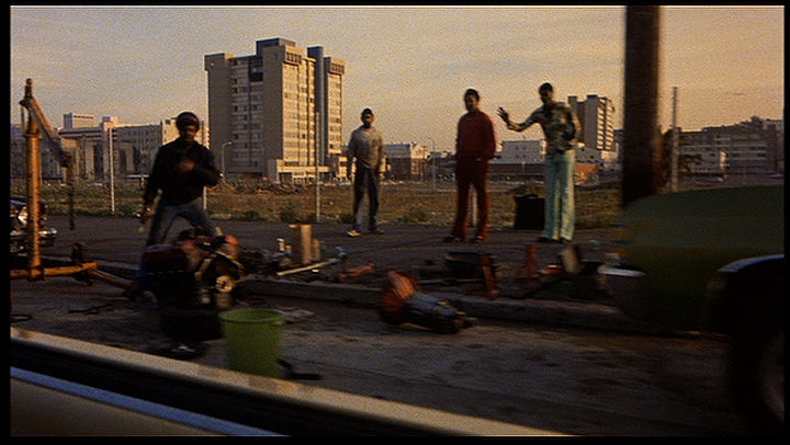 Guys fixing cars on Fillmore 1978.jpg