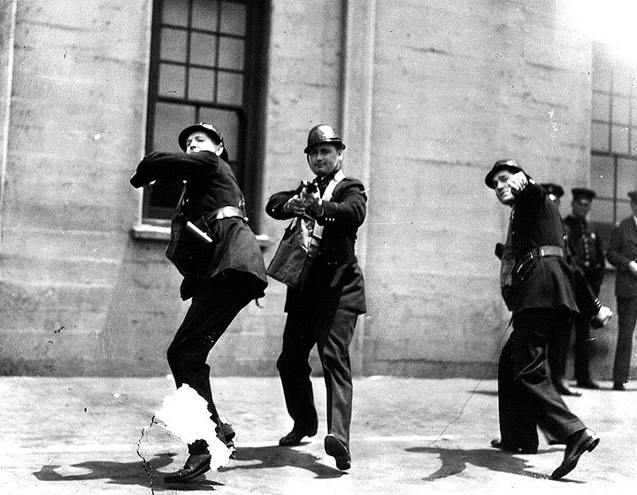 Staged-publicity-shot-of-SF-police-practicing-with-tear-gas ILWU-archives.jpg