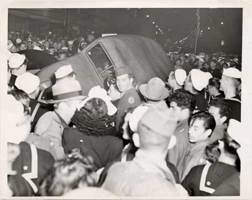 Celebration end of WWII Crowd overturns newspaper delivery truck Aug 15 1945 AAF-0185.jpg