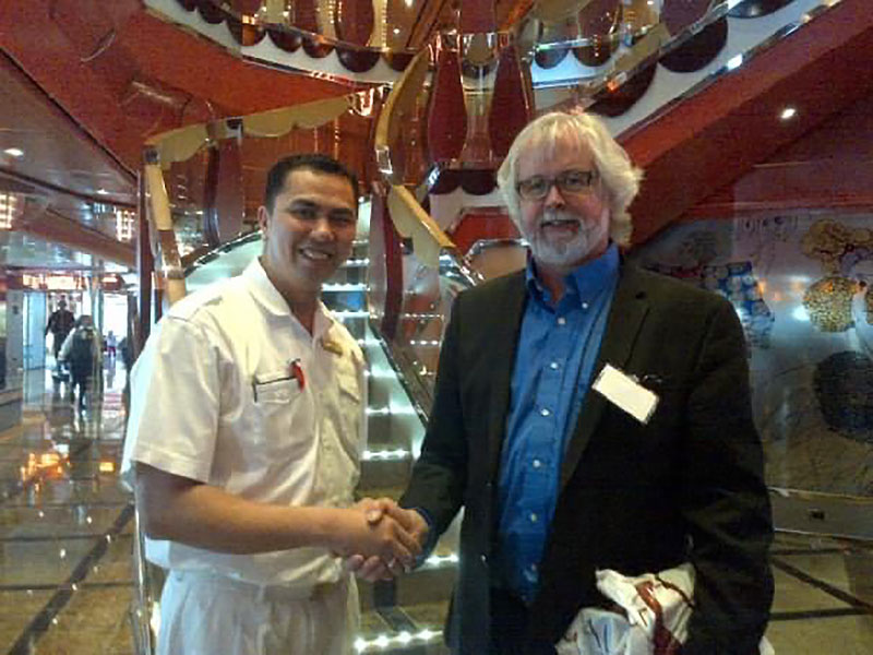 File:Paulson-and-cruise-ship-crew-guy 3887.jpg