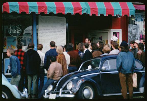 File:Cushman-march-14-1968-crowd-reads-sign-Eat-Drink-and-Be-Merry-on-Haight-St-P15616.jpg