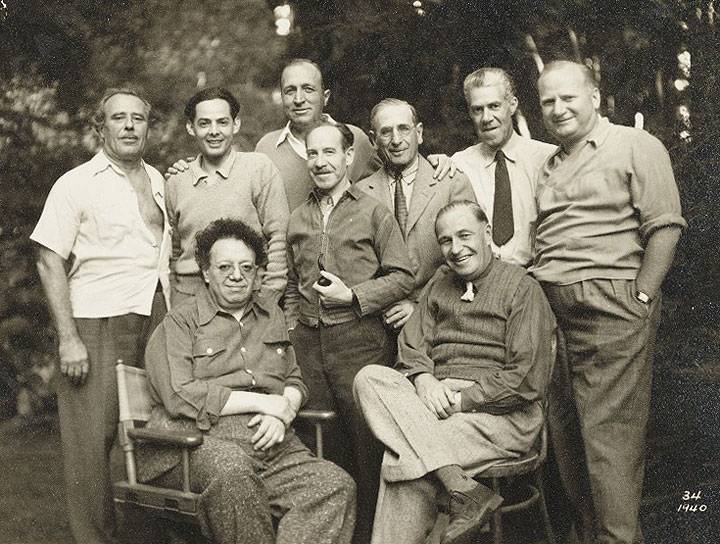 Diego-Rivera-far-left-first-row-Lucien-Labaudt-standing-far-left-and-Otis-Oldfield-center-with-pipe-pose-for-a-photo.-AAA labaluci 11874.jpg