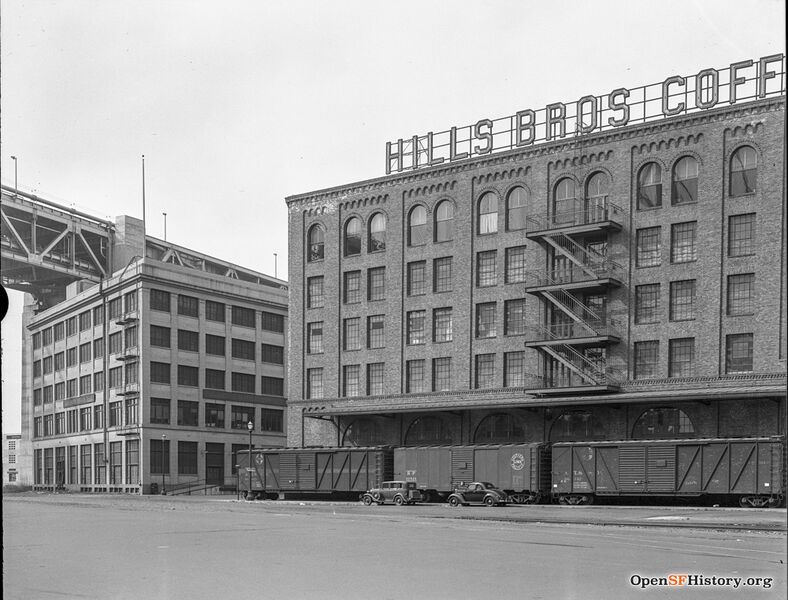 File:View west across Embarcadero to bridge, Hills Brothers Coffee Plant with freight cars alongside 1938 opensfhistory wnp14.2714.jpg