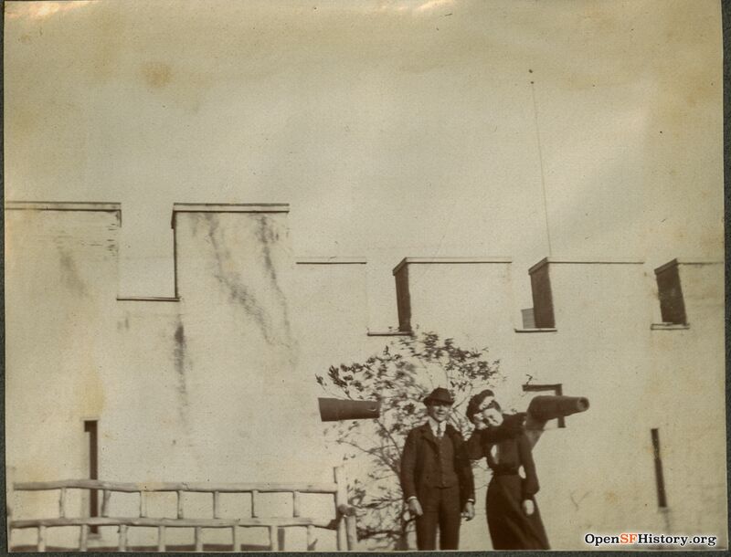 Mission Zoo, two people posing in front of model of Morro Castle, located at approximately today's Mizpah and Sussex Street c1899 opensfhistory wnp27.6529.jpg