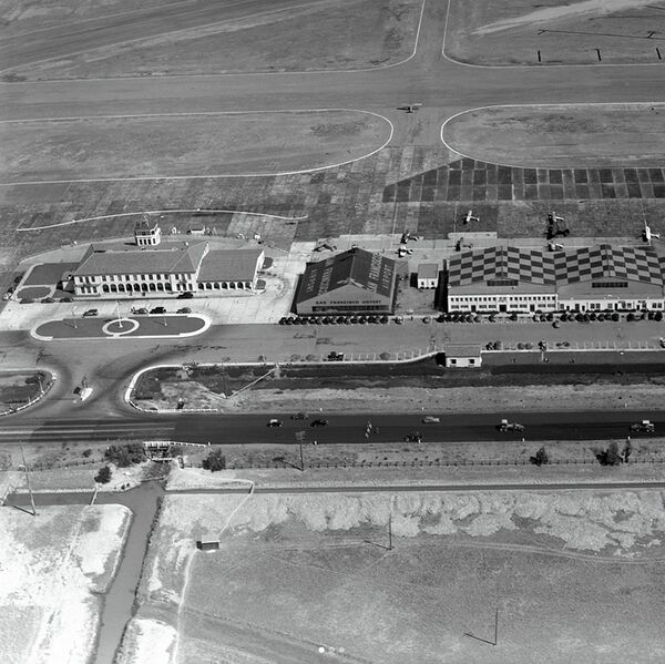 File:By-1937,-more-than-790,000-square-feet-of-concrete-runways,-taxiways,-and-aircraft-parking-were-in-place,-illuminated-by-modern,-multicolored-lighting-and-45,700-feet-of-underground-power-lines.jpg
