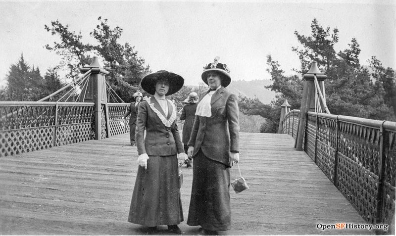 File:Ggp c 1915 View North toward Mt. Sutro. Two women posing on Roebling steel pedestrian bridge over Middle Drive (now Nancy Pelosi Drive) wnp27.7029.jpg