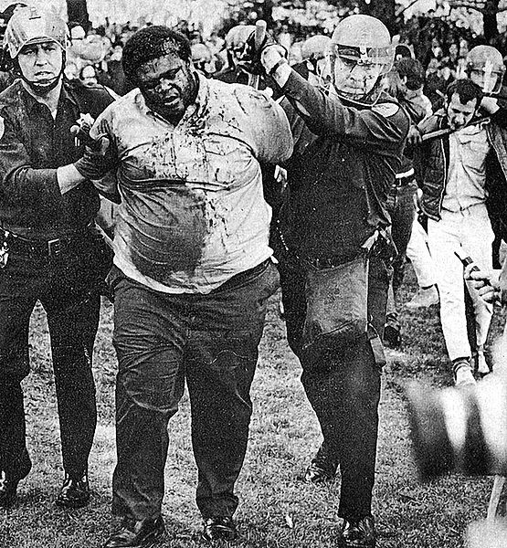 File:Don-McAllister-bleeding-in-police-custody-SF-State-1968-photo-by-Terry-Schmitt.jpg