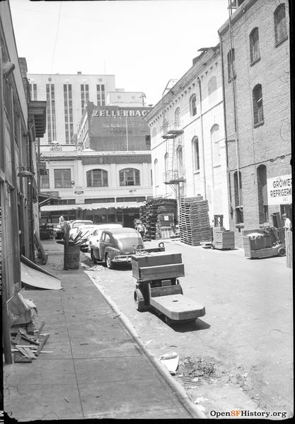 File:May 1959 View west on 200 block of Oregon Street. Pallet jacks, forklifts, pallets of wholesale produce companies wnp28.1203.jpg